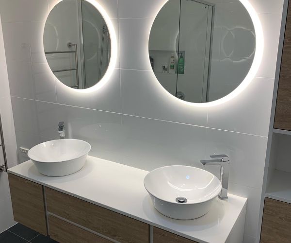 Modern shower area with sleek tiles and lighting