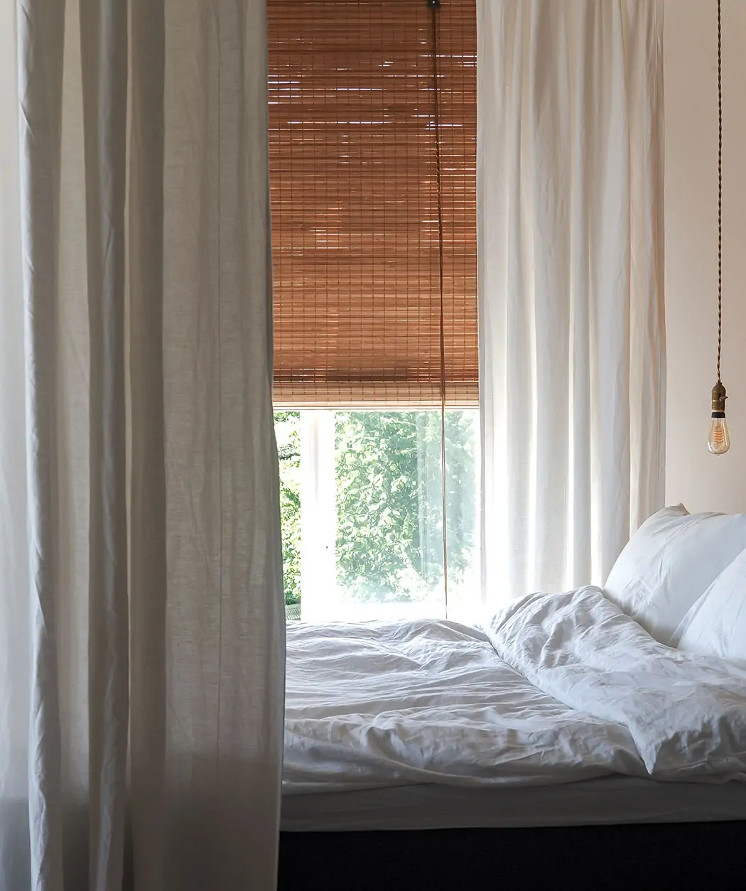 Brown privacy bamboo roller blind - Image 2